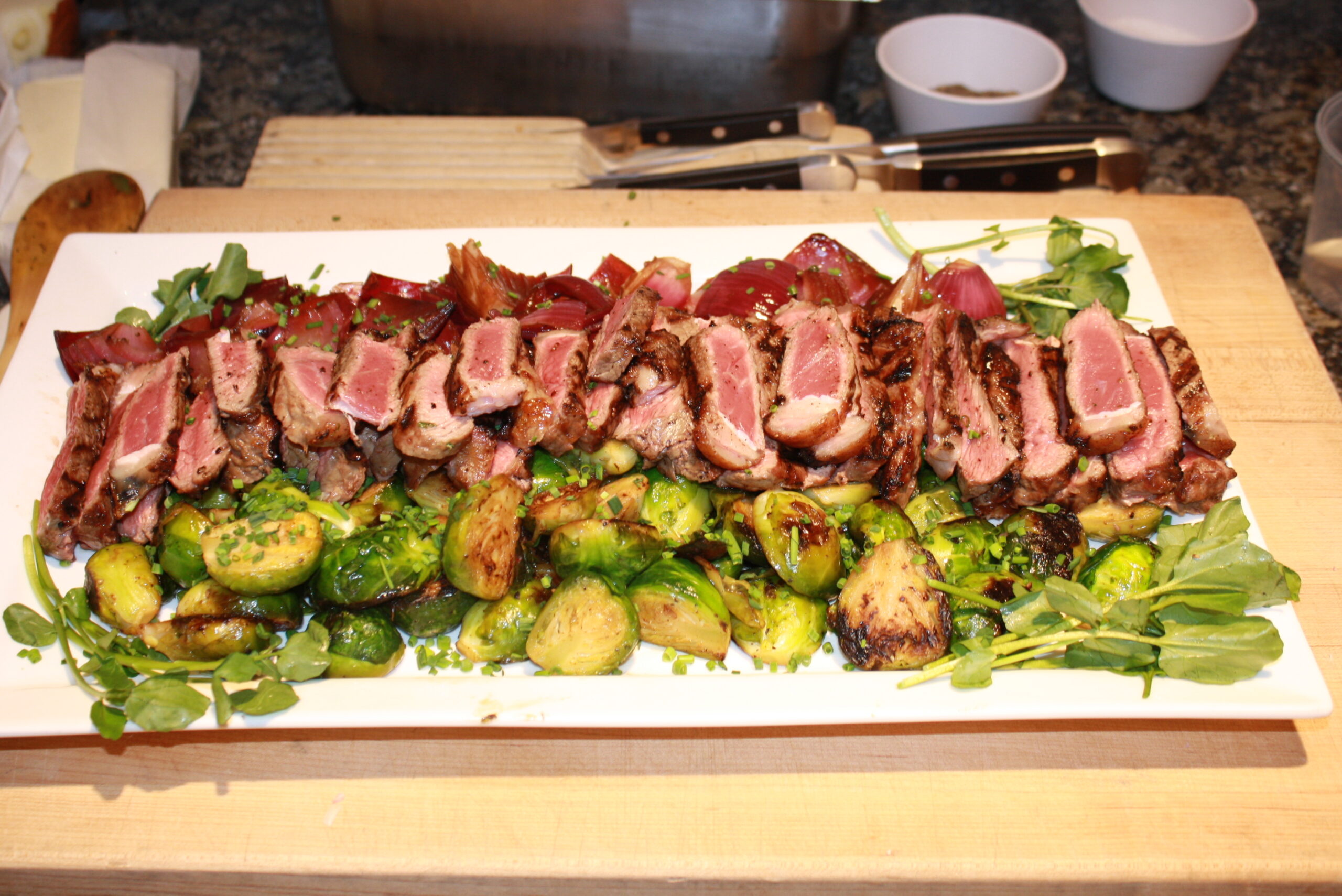 Grilled Steaks with Brussels Sprouts and Balsamic Red Onions