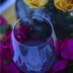 Red wine and yellow roses with bougainvillea